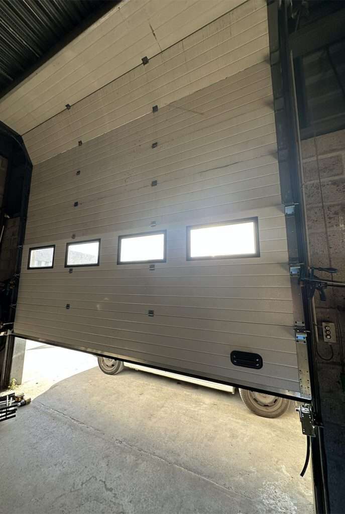 installation dépannage motorisation porte de garage sectionnelle